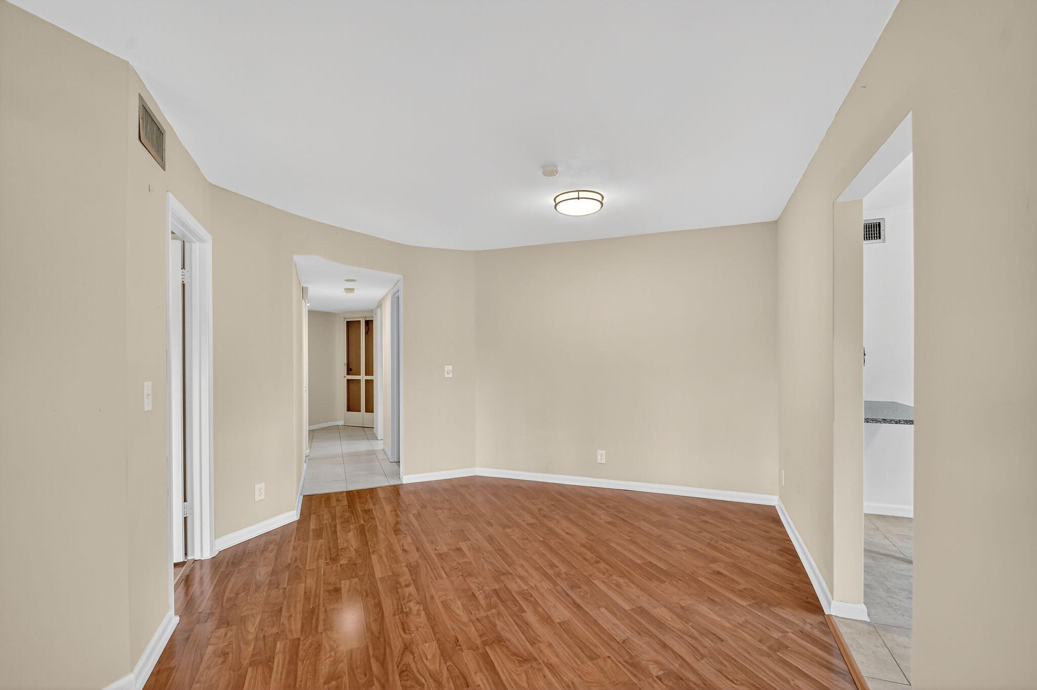 5040 Rose Hill Drive, Unit 206 Boynton Beach, FL 33437 - Photo 11 of 54 a view of empty room with wooden floor