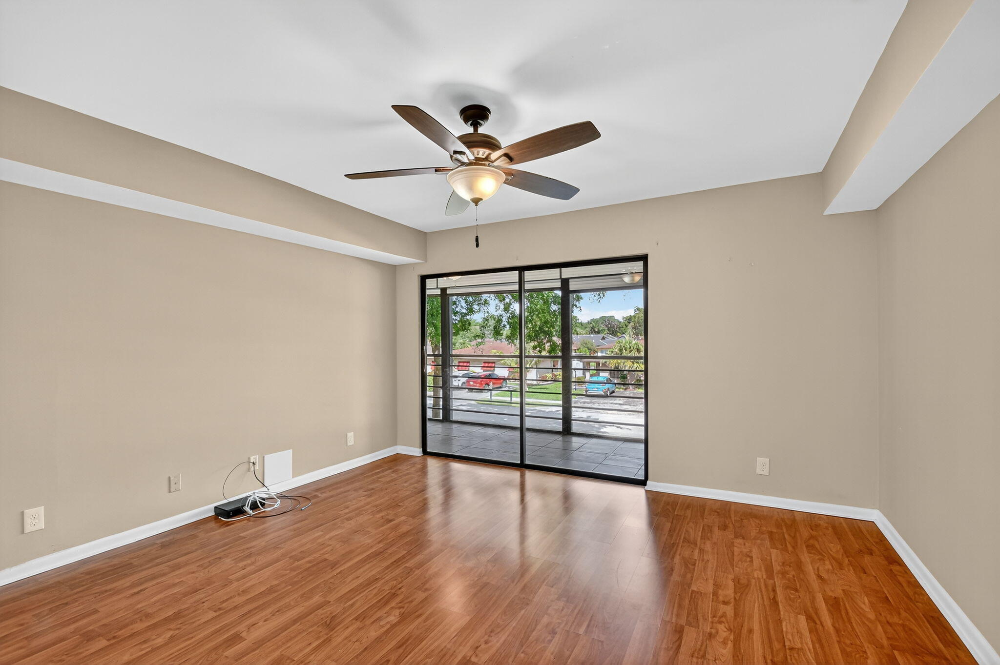 5040 Rose Hill Drive, Unit 206 Boynton Beach, FL 33437 - Photo 25 of 54 wooden floor in an empty room with a window