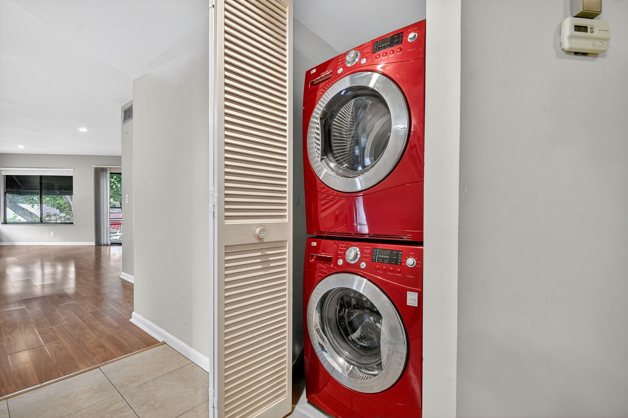 5040 Rose Hill Drive, Unit 206 Boynton Beach, FL 33437 - Photo 33 of 54 a utility room with dryer and washer