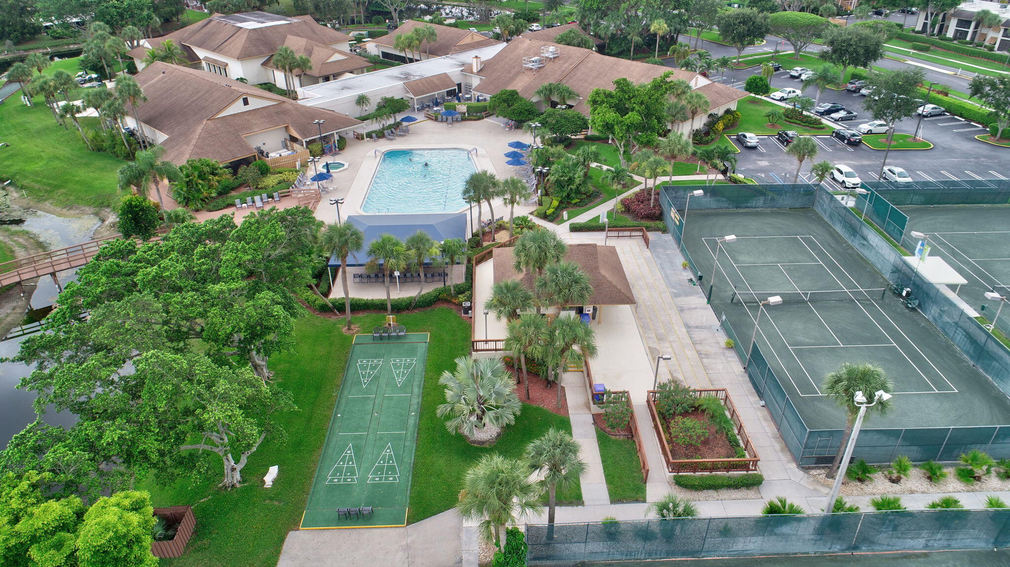 5040 Rose Hill Drive, Unit 206 Boynton Beach, FL 33437 - Photo 42 of 54 an aerial view of multiple houses with yard