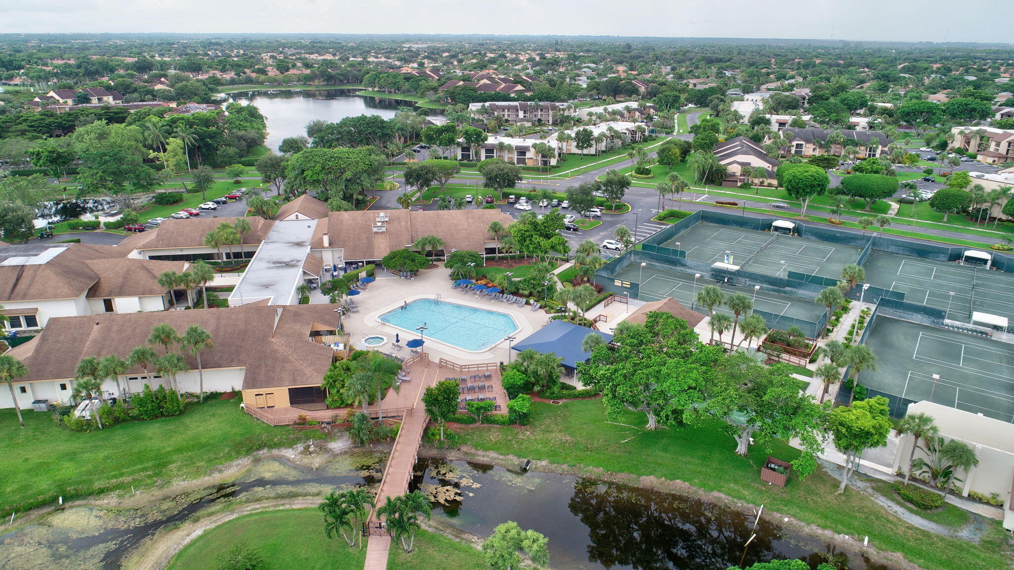5040 Rose Hill Drive, Unit 206 Boynton Beach, FL 33437 - Photo 45 of 54 an aerial view of residential houses with outdoor space and trees