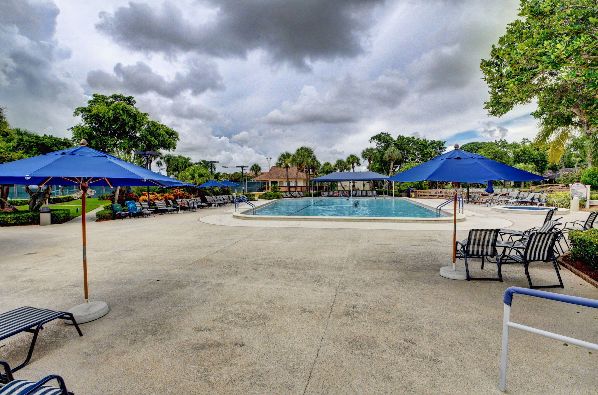 5040 Rose Hill Drive, Unit 206 Boynton Beach, FL 33437 - Photo 48 of 54 an outdoor space with patio and white umbrellas