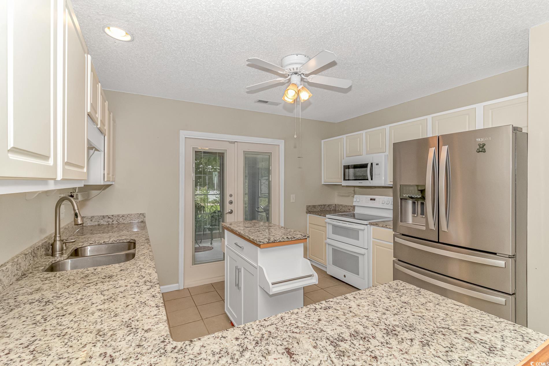441 Plymouth Loop Longs, SC 29568 - Photo 13 of 33 Kitchen with visible vents, light tile patterned f