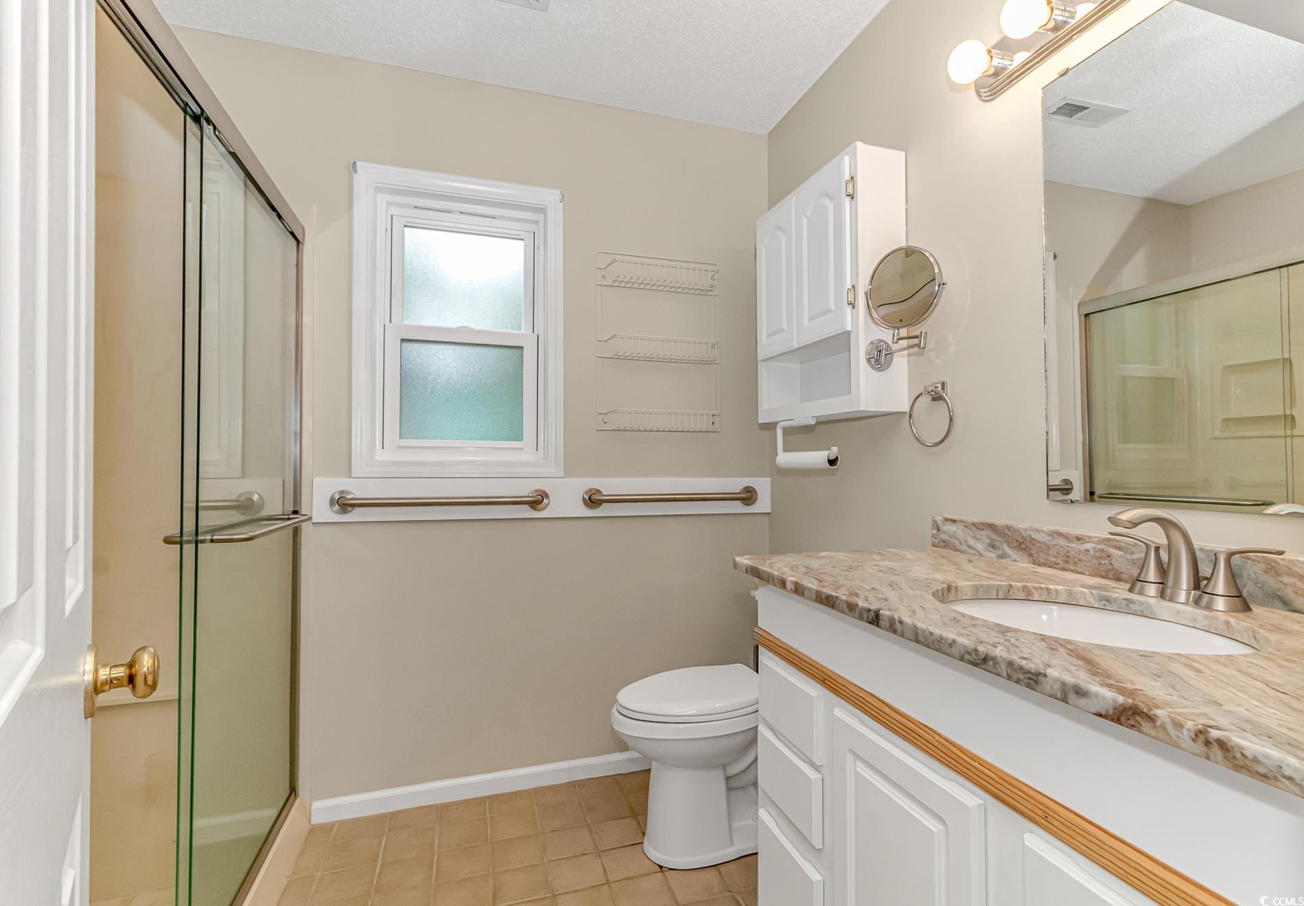 441 Plymouth Loop Longs, SC 29568 - Photo 21 of 33 Bathroom with visible vents, toilet, a stall showe