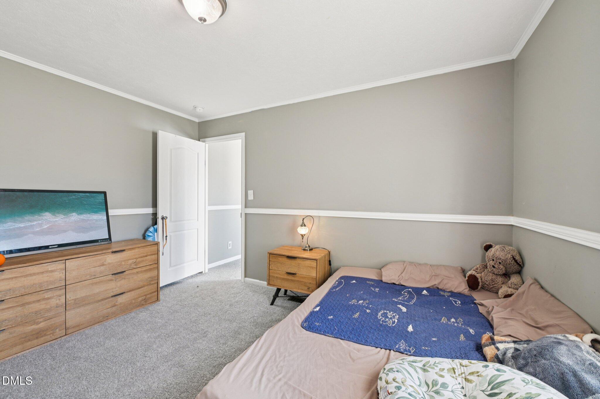 2186 Piney Grove Church Road Kenly, NC 27542 - Photo 21 of 30 a bedroom with a bed and a dresser