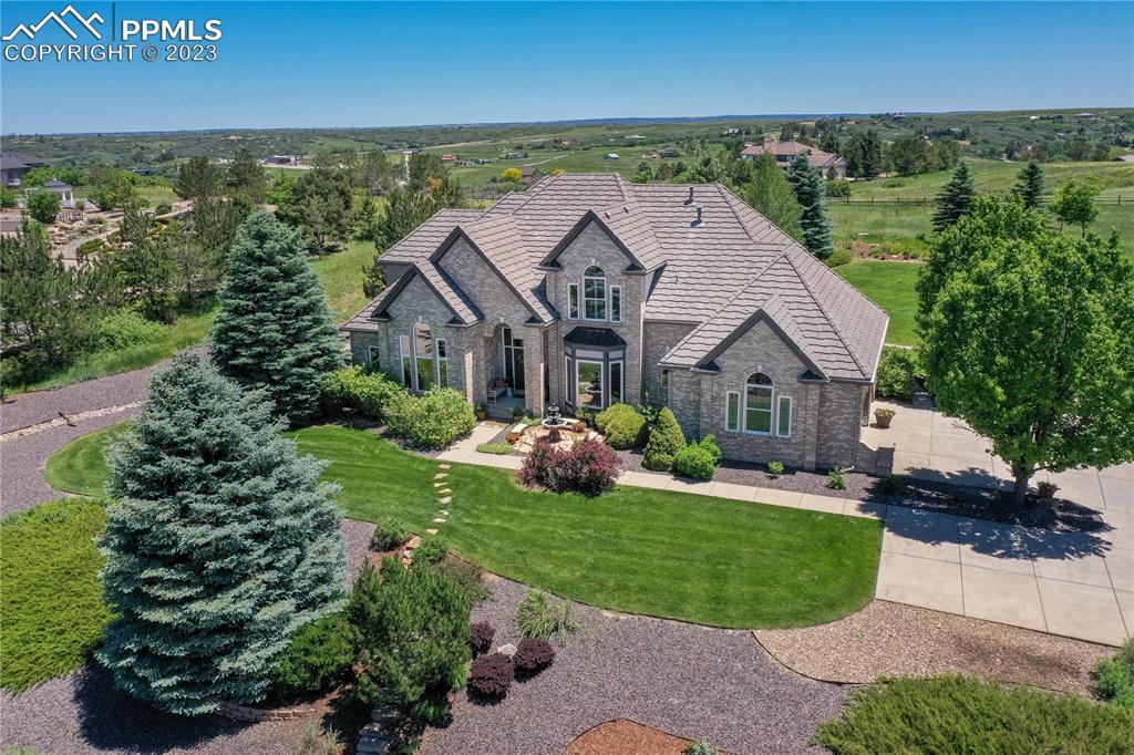 an aerial view of a house with garden