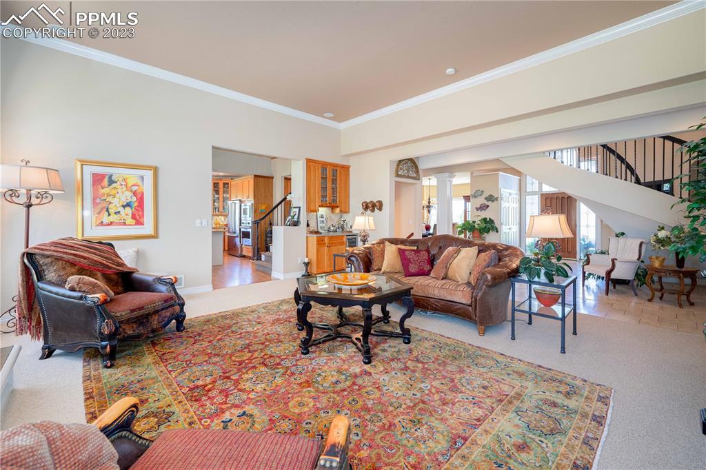 8760 Ridgepointe Drive Castle Pines, CO 80108 - Photo 16 of 50 a living room with furniture and a large window