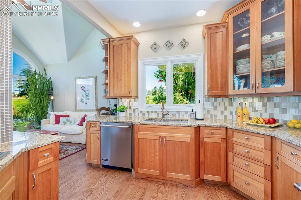 8760 Ridgepointe Drive Castle Pines, CO 80108 - Photo 21 of 50 a kitchen with a sink stove and cabinets