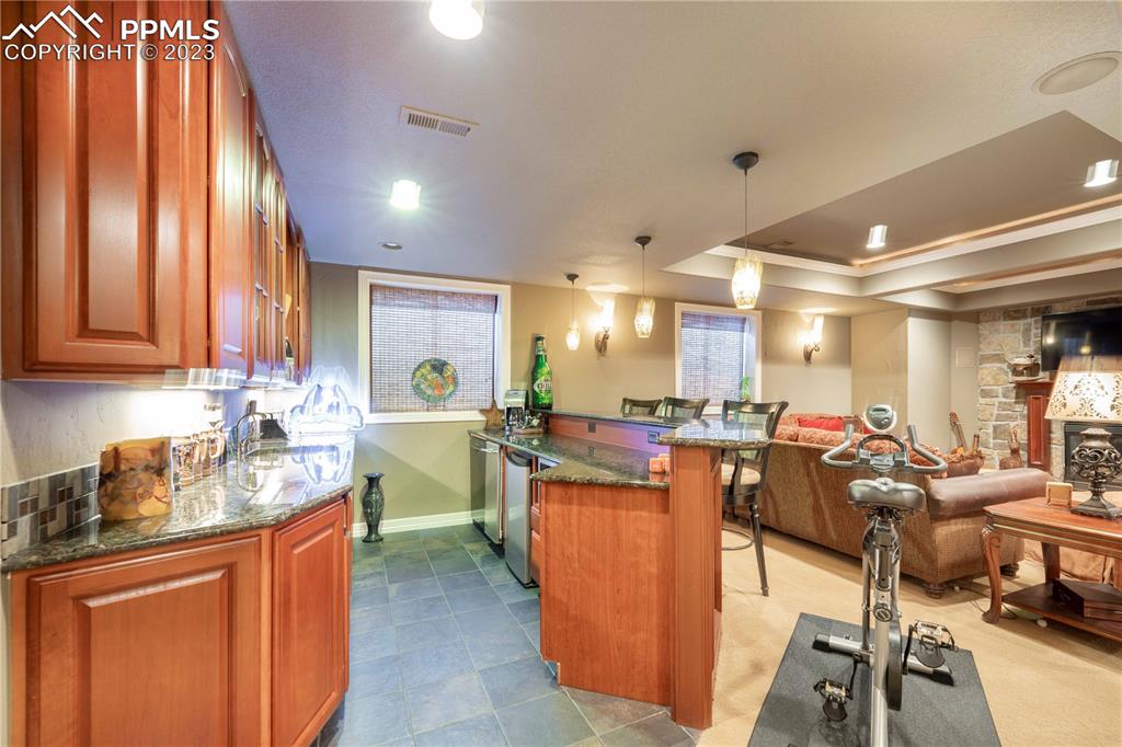 8760 Ridgepointe Drive Castle Pines, CO 80108 - Photo 26 of 50 a kitchen with lots of counter top space