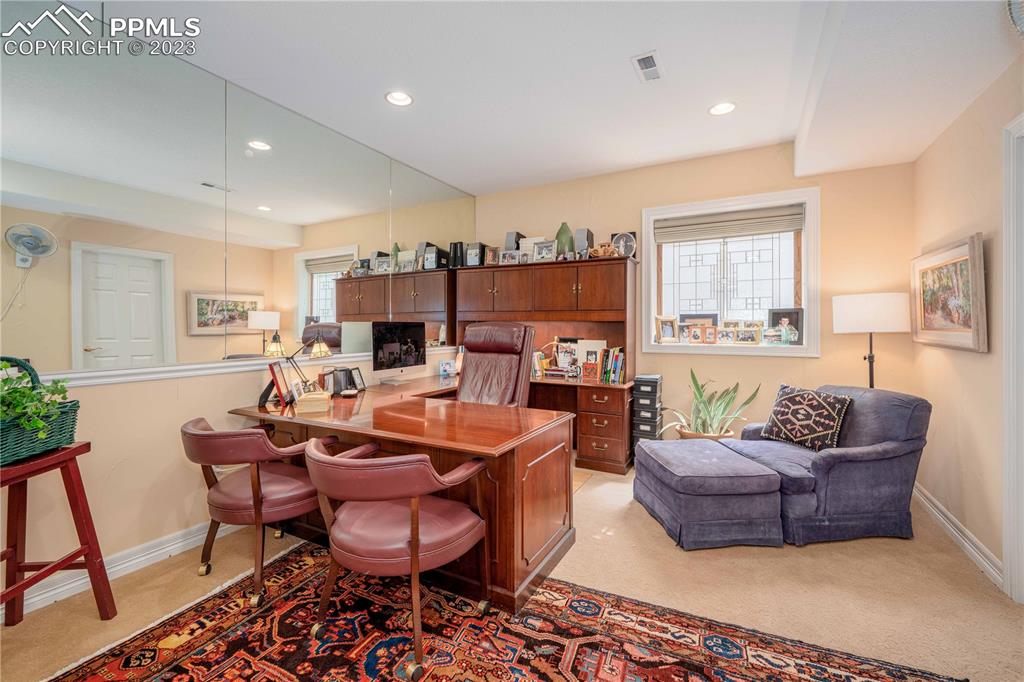 8760 Ridgepointe Drive Castle Pines, CO 80108 - Photo 36 of 50 a living room with furniture kitchen view and a large window