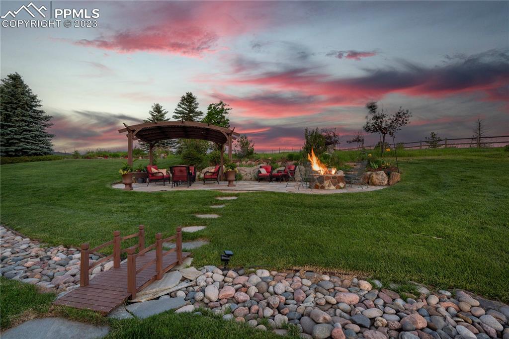 8760 Ridgepointe Drive Castle Pines, CO 80108 - Photo 46 of 50 a view of a park with large trees