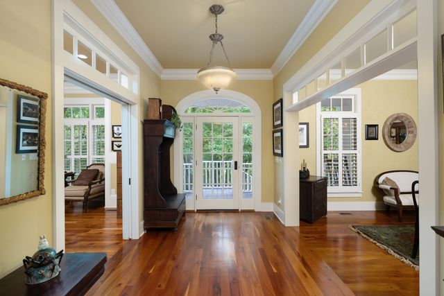 a view of a kitchen with stainless steel appliances granite countertop a sink and cabinets