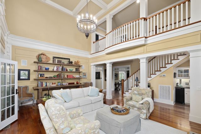a dining room with furniture and wooden floor