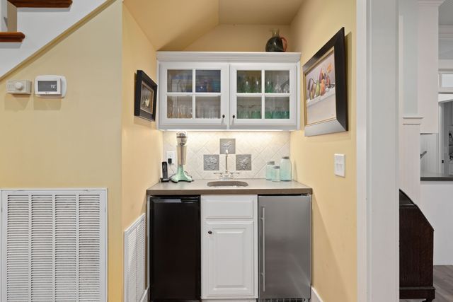 a bedroom with furniture and wooden floor
