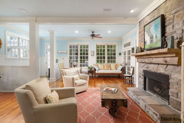 a view of a patio with a table chairs and a yard