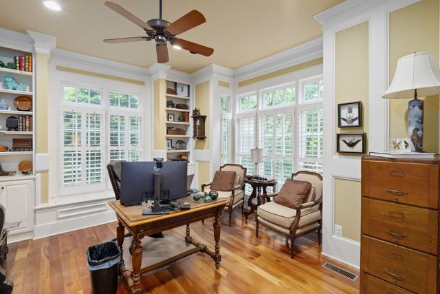 a view of a park with large trees