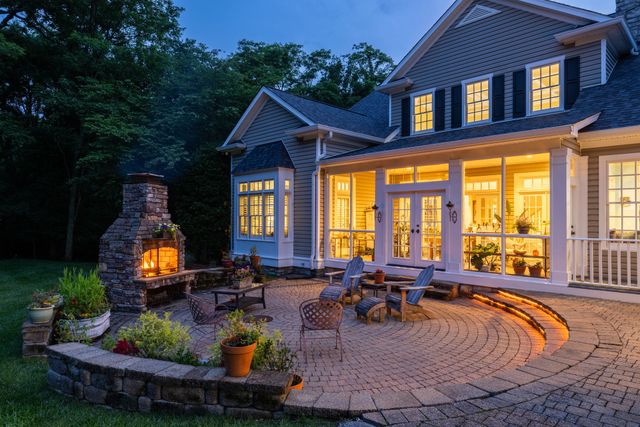 a view of a house with backyard and porch