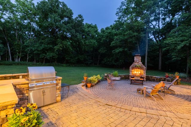 an aerial view of a house with yard swimming pool and outdoor seating