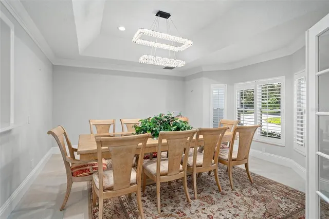 a bedroom with a large bed and a large window