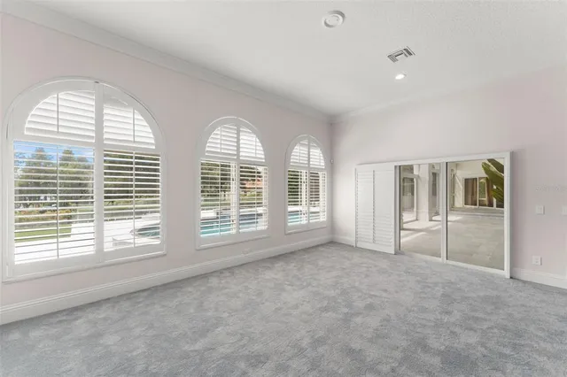 a kitchen with cabinets appliances and a window