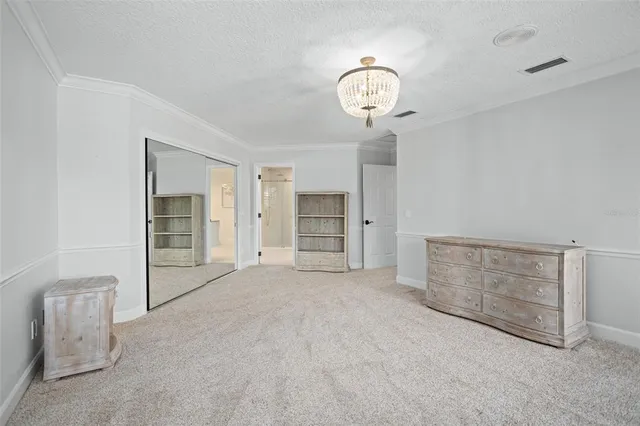 a view of a patio with a dining table and chairs with wooden fence