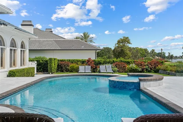 a view of swimming pool with a patio