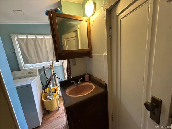 a bathroom with a sink a mirror and a toilet
