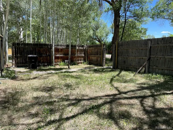 a fire hydrant in the middle of a yard