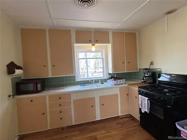 a kitchen with a sink and cabinets