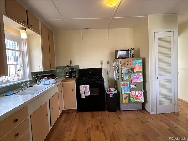 a kitchen with stainless steel appliances a refrigerator and a sink