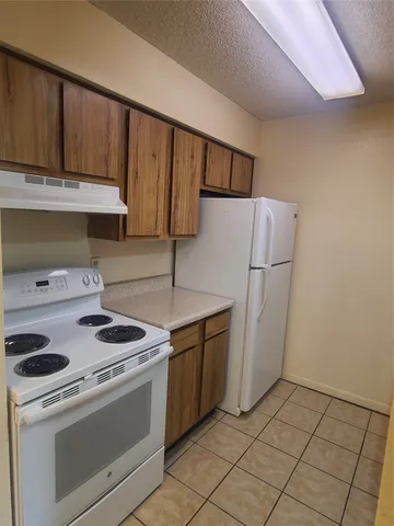 a bathroom with a double vanity sink toilet and shower