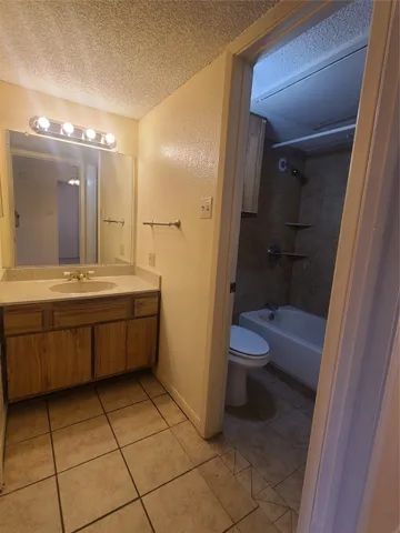 a white bath tub sitting next to a white toilet