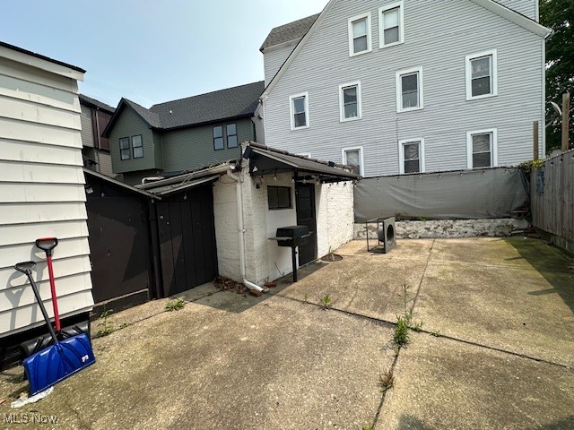 1913 Coltman Road Cleveland, OH 44106 - Photo 25 of 32 Rear view of house featuring a fenced backyard and a patio