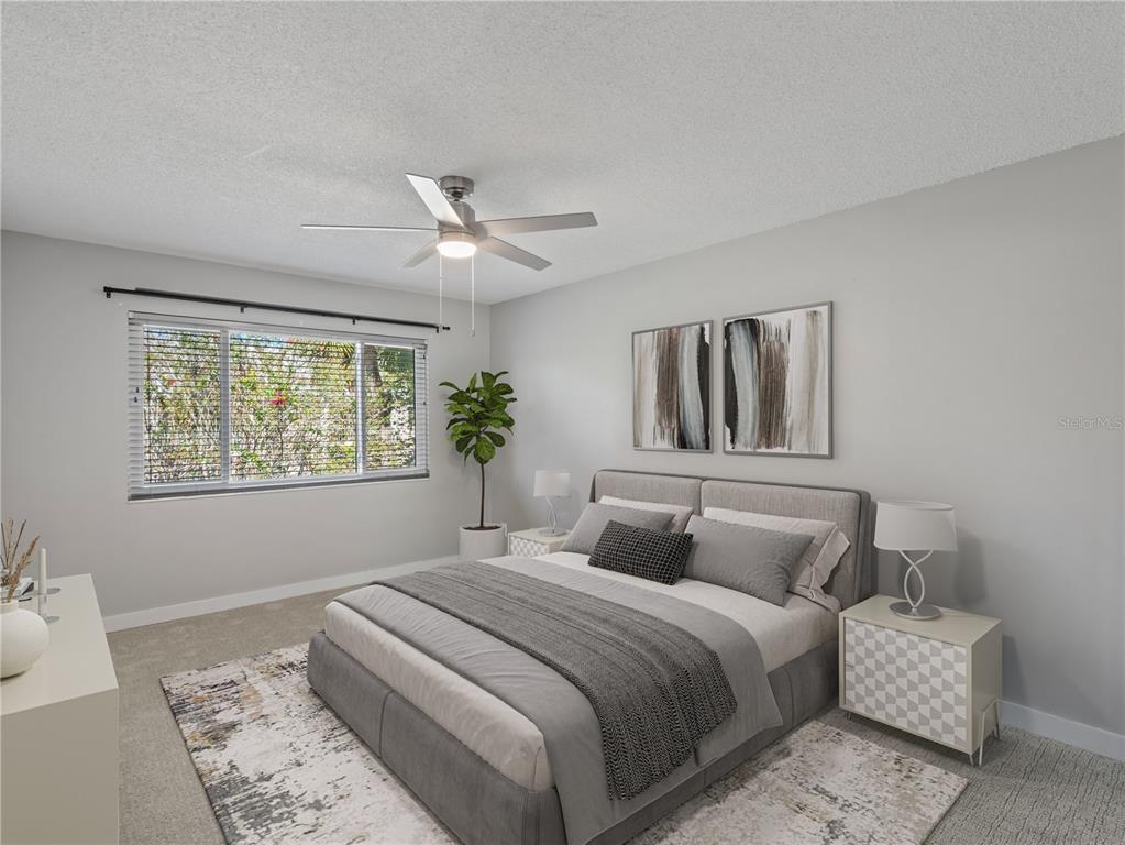 1250 South Denning Drive, Unit 213 Winter Park, FL 32789 - Photo 14 of 20 a bedroom with a large bed and a window