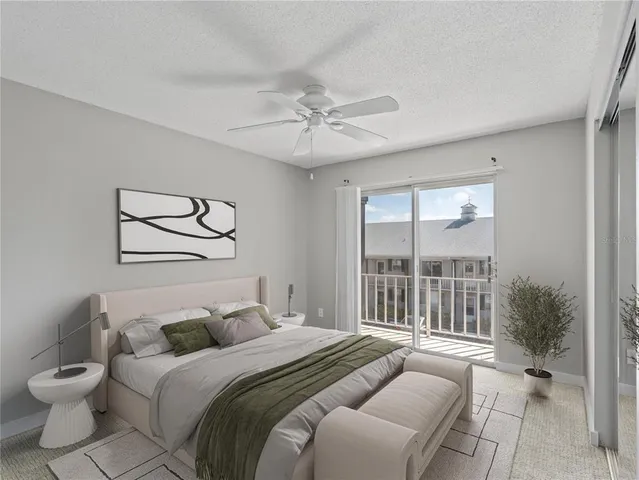 a spacious bedroom with a bed and a large window