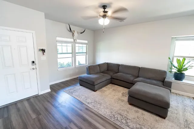 a living room with furniture and a window