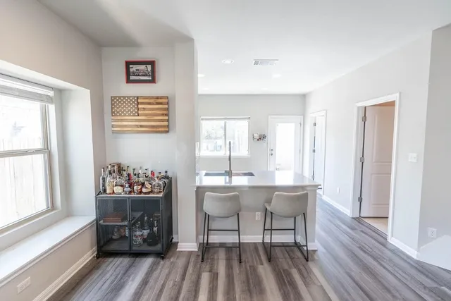 a view of a dining room with furniture window and wooden floor