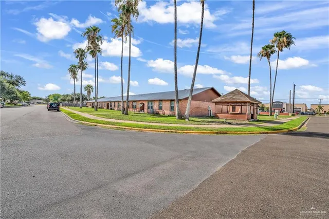 a view of a swimming pool with a yard
