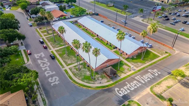 an aerial view of a house with a swimming pool