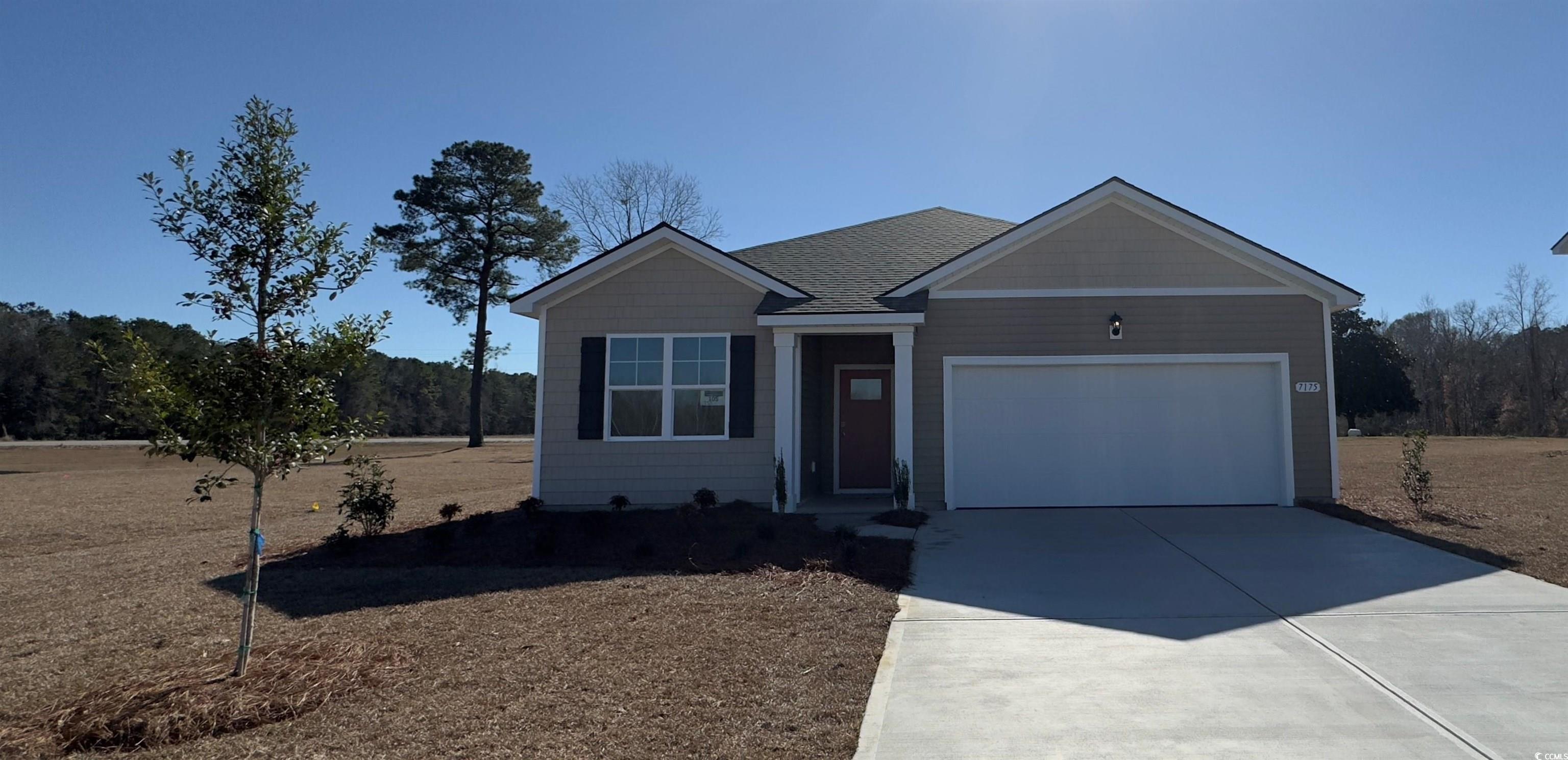 7175 Meadow Walk Loop Loris, SC 29569 - Photo 1 of 13 Ranch-style house featuring a garage, driveway, an