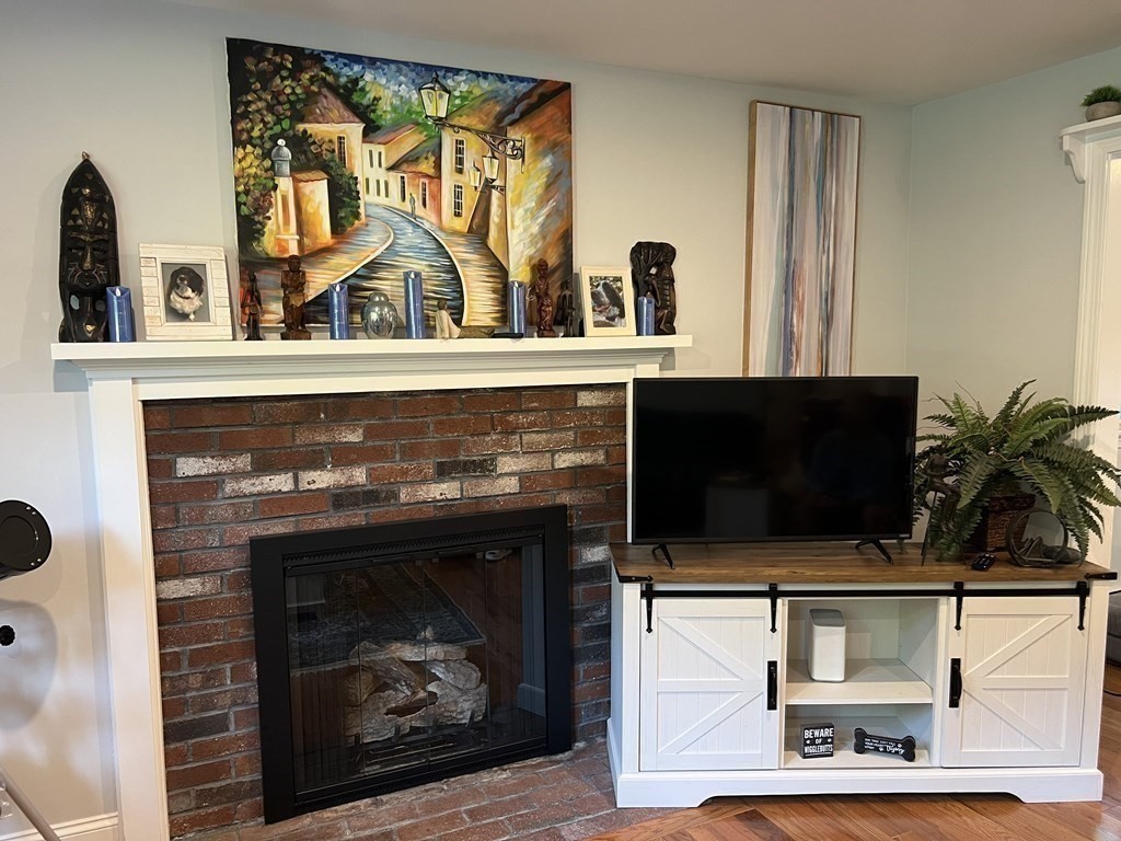 20 Nantucket Trail Sandwich, MA 02563 - Photo 11 of 30 a fireplace with a clock on the wall