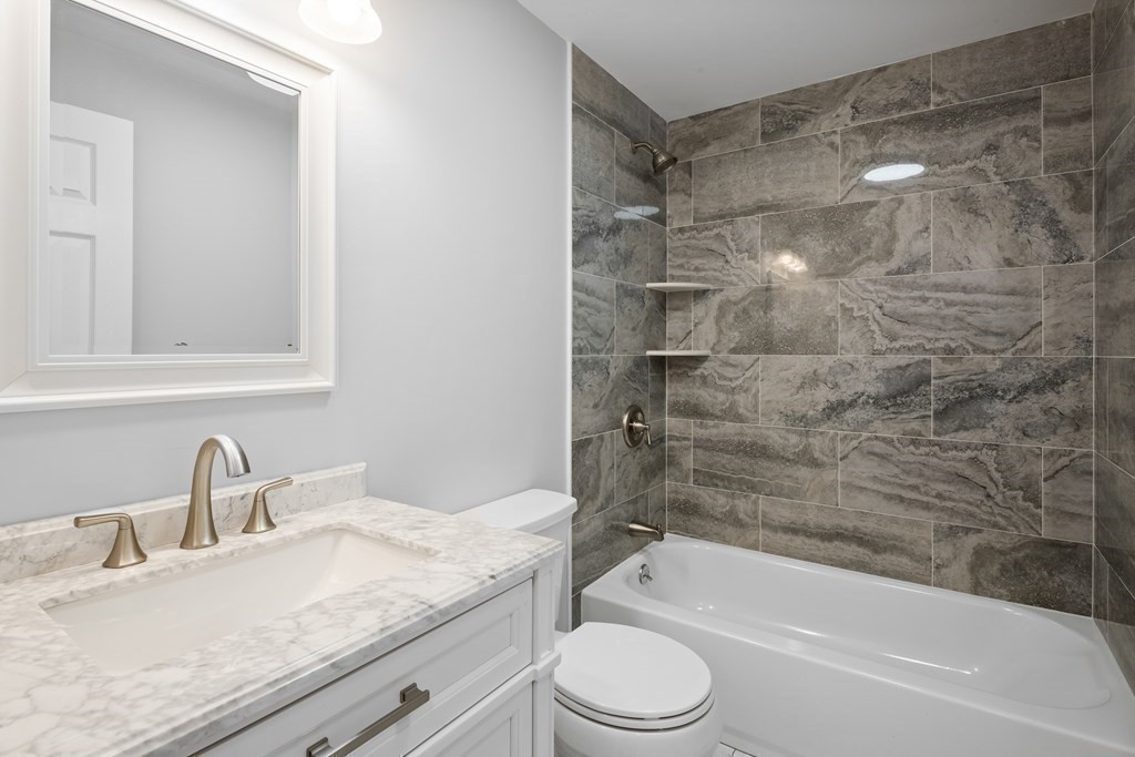 20 Nantucket Trail Sandwich, MA 02563 - Photo 13 of 30 a bathroom with a granite countertop bathtub shower sink vanity and toilet