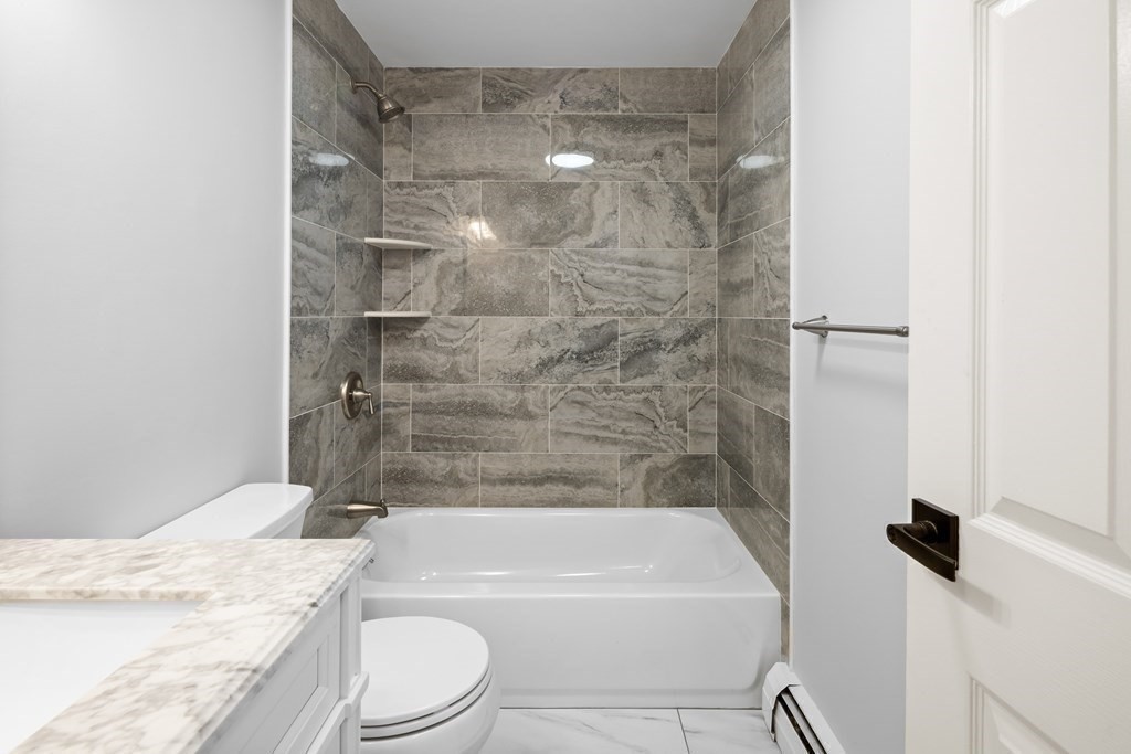 20 Nantucket Trail Sandwich, MA 02563 - Photo 14 of 30 a bathroom with a granite countertop bathtub shower sink vanity and toilet