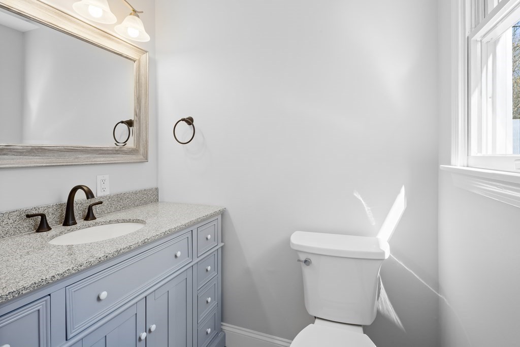 20 Nantucket Trail Sandwich, MA 02563 - Photo 15 of 30 a bathroom with a toilet sink and mirror