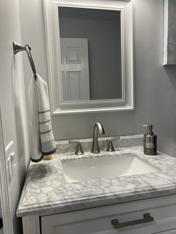 20 Nantucket Trail Sandwich, MA 02563 - Photo 16 of 30 a bathroom with a granite countertop sink and a mirror