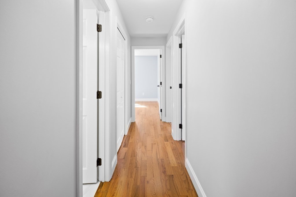 20 Nantucket Trail Sandwich, MA 02563 - Photo 18 of 30 a view of a hallway with wooden floor