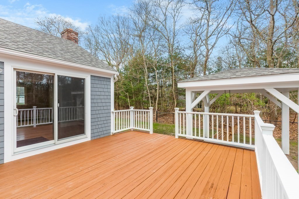 20 Nantucket Trail Sandwich, MA 02563 - Photo 19 of 30 a view of backyard with deck and wooden floor