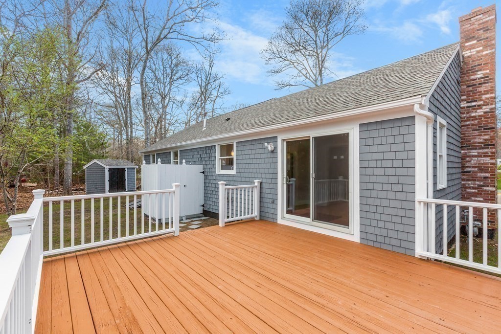 20 Nantucket Trail Sandwich, MA 02563 - Photo 20 of 30 a view of backyard with deck and wooden floor