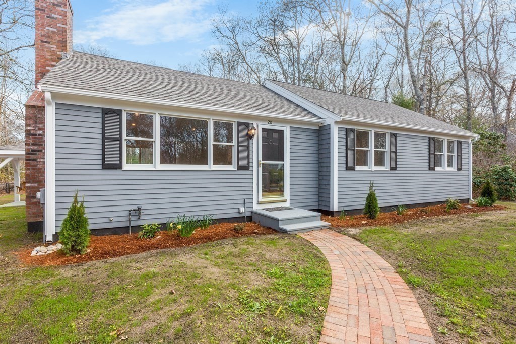 20 Nantucket Trail Sandwich, MA 02563 - Photo 2 of 30 a front view of a house with a yard