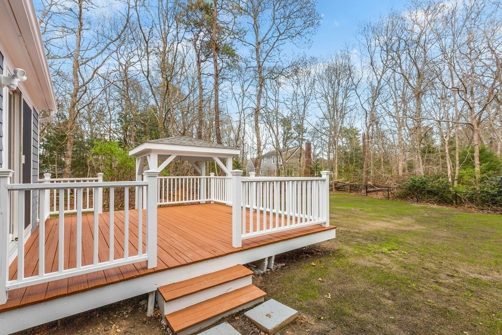 20 Nantucket Trail Sandwich, MA 02563 - Photo 26 of 30 a view of a wooden deck with a yard